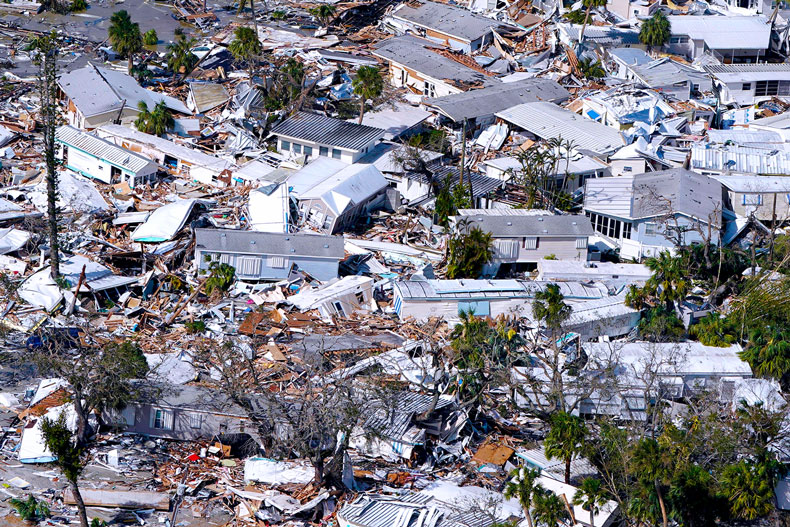 Damaged homes and debris are shown in the aftermath of Hurricane Ian, Thursday, Sept. 29, 2022, in Fort Myers Beach, Fla. (AP Photo/Wilfredo Lee)