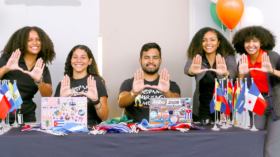 From left, Stephanie Nuñez, Adriana Ramirez, David Raez, Kennedy Robinson, and Taylor Castro are photographed at the Hispanic Heritage Month opening ceremony on Friday, Sept. 16. Photo: Catherine Mairena/University of Miami Division of Student Affairs