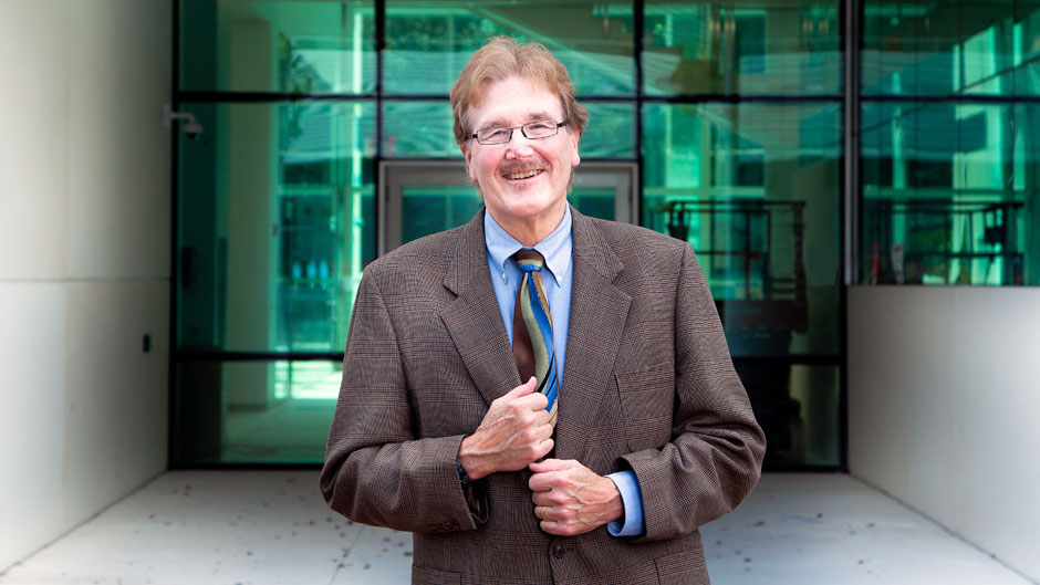 Mark Yeager stands in front of the new Frost Institute for Chemistry and Molecular Science on the Coral Gables Campus.