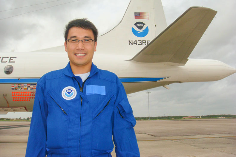 Jun Zhang photographed in front of a Hurricane Hunter aircraft. Photos courtesy NOAA’s Atlantic  Oceanographic and Meteorological Laboratory (AOML)