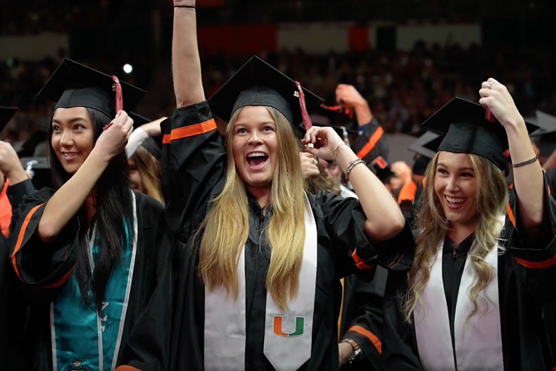 Students celebrate their graduation from the University of Miami on Friday, Dec. 16.