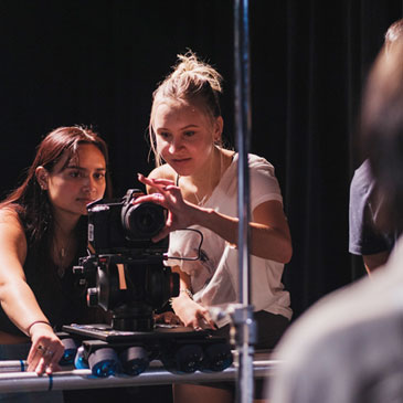 Film students in professor Ed Talavera’s class learn key skills in cinematography, while helping to create music videos at no cost for emerging artists.