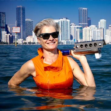 University of Miami professor Lisa Beal poses for a picture in the water off Key Biscayne holding a MicroCAT scientific instrument that measures conductivity, temperature, and pressure of the ocean water. Photo: Joshua Prezant/University of Miami