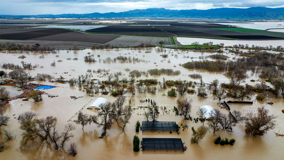 Floodwaters cover a property along River Rd. in Monterey County, Calif., as the Salinas River overflows its banks on Friday, Jan. 13, 2023. (AP Photo/Noah Berger)