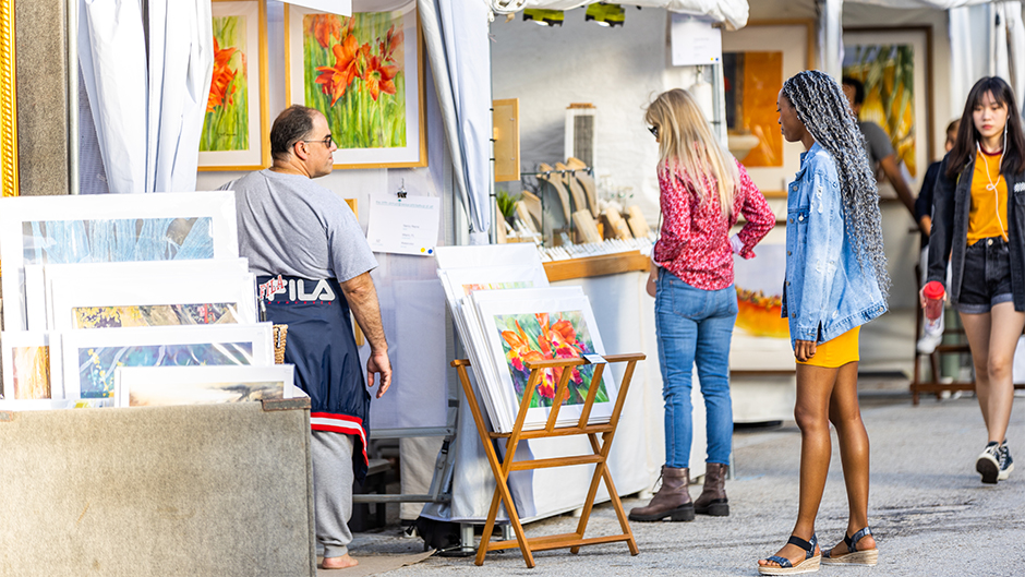 Festival attendees browse works of art at the Beaux Arts Festival of Art in 2020 on the Coral Gables Campus. 