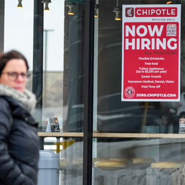 A hiring sign is displayed at a Chipotle restaurant in Schaumburg, Ill., Monday, Jan. 30, 2023. America’s employers added a robust 517,000 jobs in January, a surprisingly strong gain in the face of the Federal Reserve’s aggressive drive to slow growth and tame inflation with higher interest rates. (AP Photo/Nam Y. Huh) 