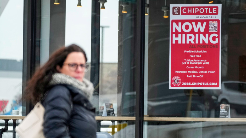 A hiring sign is displayed at a Chipotle restaurant in Schaumburg, Ill., Monday, Jan. 30, 2023. America’s employers added a robust 517,000 jobs in January, a surprisingly strong gain in the face of the Federal Reserve’s aggressive drive to slow growth and tame inflation with higher interest rates. (AP Photo/Nam Y. Huh)