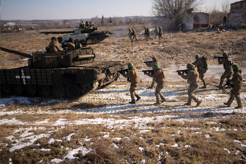 Ukrainian servicemen of the 3rd Separate Tank Iron Brigde take part in an exercise in the Kharkiv area, Ukraine, Thursday, Feb. 23, 2023, the day before the one year mark since the war began. War has been a catastrophe for Ukraine and a crisis for the globe and the world is a more unstable and fearful place since Russia invaded its neighbor on Feb. 24, 2022. (AP Photo/Vadim Ghirda)