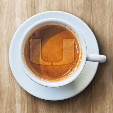 U mark in foam on a coffee. Graphic by Kevin Corrales 
