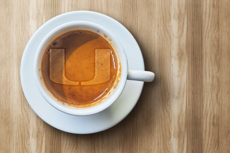 U mark in foam on a coffee. Graphic by Kevin Corrales 