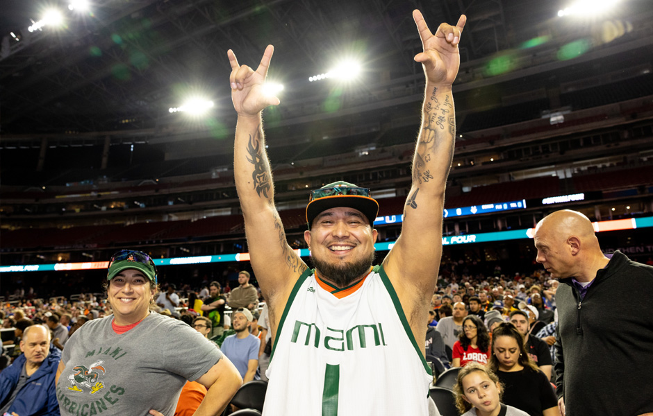 Houston, TX --03-31-2023-- Photo by Joshua Prezant/University of Miami—Andres Perez, who lives in Ohio, flew in from Detroit after selling a bunch of University of Miami signed memorabilia in order to buy his tickets, cheers on the team during open Practice for the University of Miami Men's basketball team Friday afternoon at the NGR stadium.  Players sign shorts and balls for young fans.