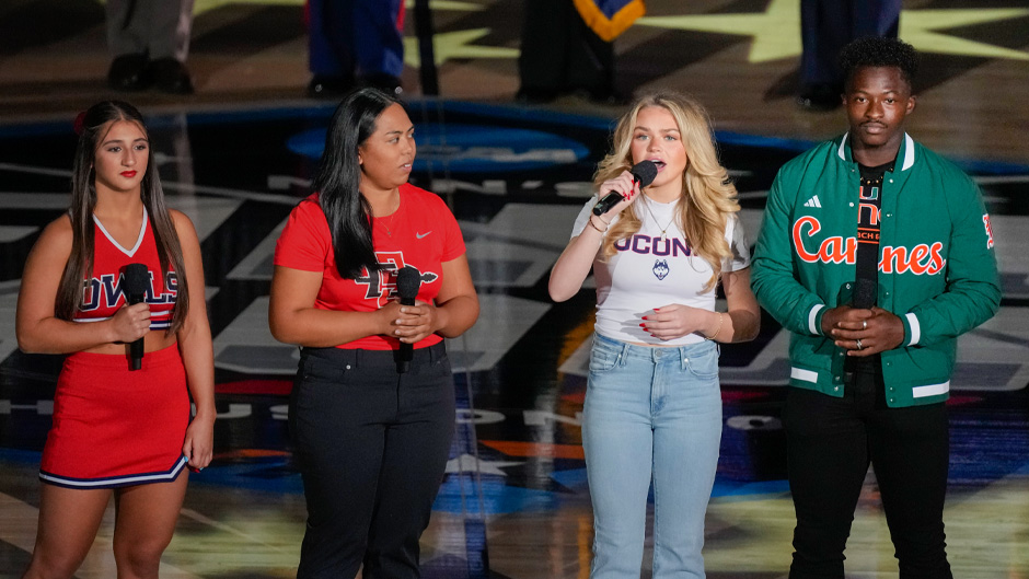 Students sing the national anthem before the first half of a Final Four college basketball game between San Diego State and Florida Atlantic in the NCAA Tournament on Saturday, April 1, 2023, in Houston. (AP Photo/Godofredo A. Vasquez)