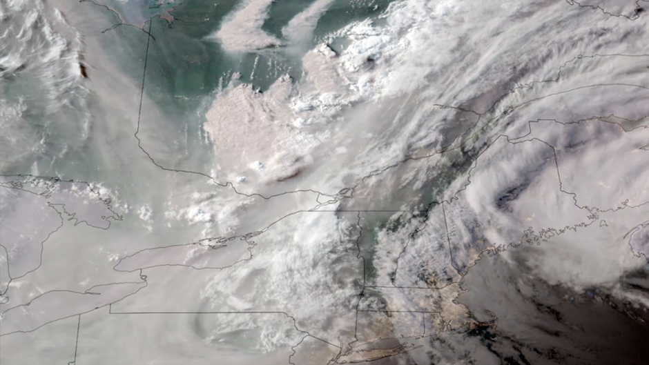 In this GOES-16 GeoColor satellite image taken Monday, June 5, 2023 at 7 p.m. EDT and provided by CIRA/NOAA, smoke from wildfires burning in Quebec, Canada, top center, drifts southward. (CIRA/NOAA via AP)