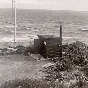 The Barbados Atmospheric Chemistry Observatory as it was in its early days. Back then, a wooden shack housed the instruments scientists used to analyze samples collected from the 55-foot tower.  Photo courtesy of BACO