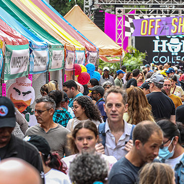 Visitors explore the street fair at the 2022 Miami Book Fair in Downtown Miami.