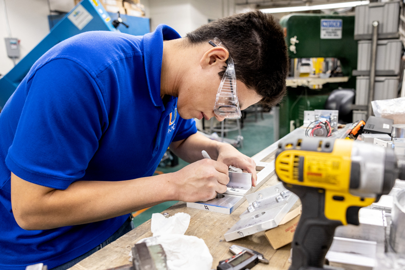 College of Engineering student Neyton Baltodano Jr. is helping to perfect the 3D-printing process for short carbon fiber materials that could ramp up the safety of the aeronautics industry. Photo: Joshua Prezant/University of Miami