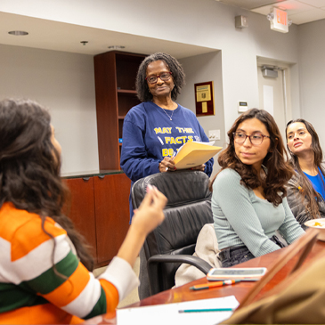 Tsitsi Wakhisi, second from left, an associate professor of professional practice, teaches a graduate class on journalism. Photo: Joshua Prezant/University of Miami 