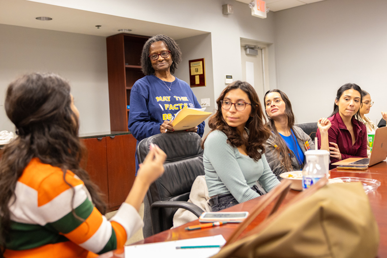 Tsitsi Wakhisi, second from left, an associate professor of professional practice, teaches a graduate class on journalism. Photo: Joshua Prezant/University of Miami 