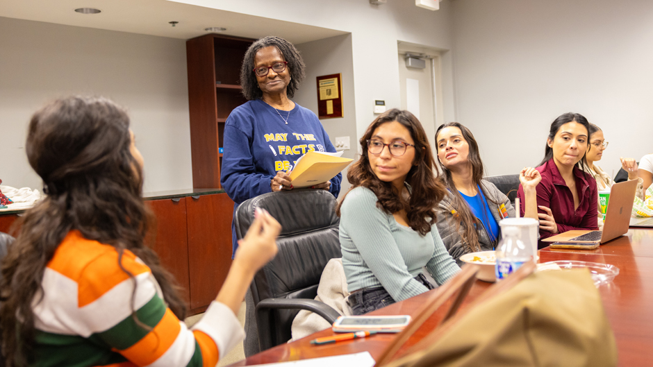 Tsitsi Wakhisi, second from left, an associate professor of professional practice, teaches a graduate class on journalism. Photo: Joshua Prezant/University of Miami