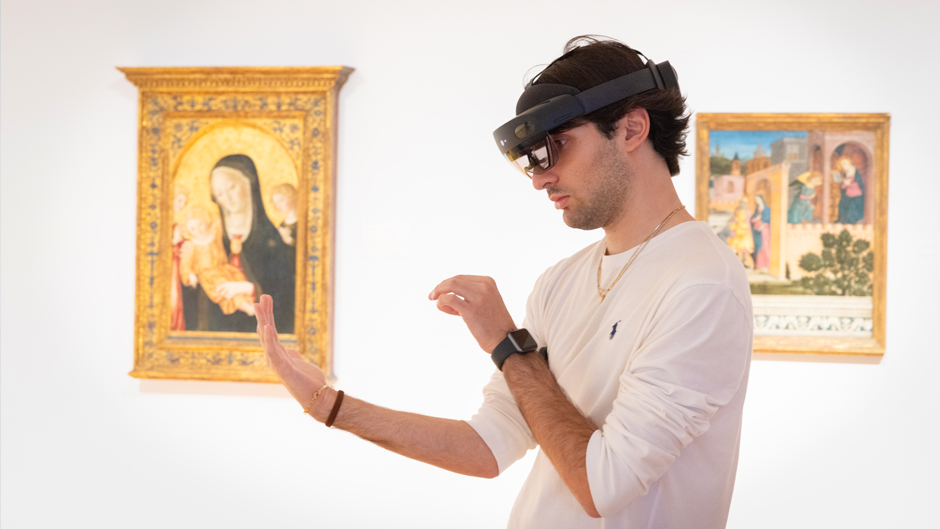PHOTO: Giacomo Zanetti, an exchange student, tries out the Collection Connection's new AR device Thursday afternoon at the Lowe Art Museum. Photo: Joshua Prezant/University of Miami