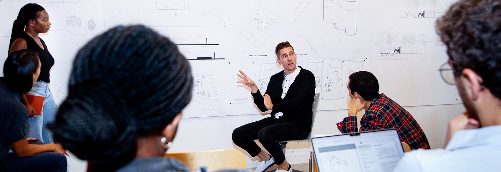 Joel Lamere (center), professor and director of the graduate program in the School of Architecture, conducts a review of first year graduate students' first project of the semester in the Thomas P. Murphy Design Studio Building. Photo: Joshua Prezant/University of Miami