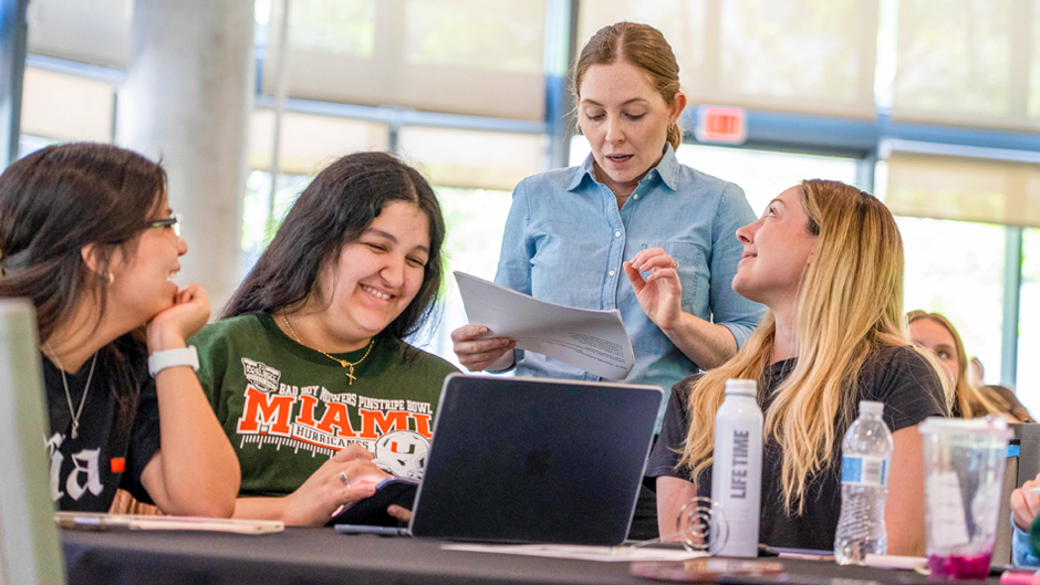 Professor Katlyn Meier reviews Chemistry 102 exam questions with a group of students during the Finish Strong study event held at Lakeside Village.