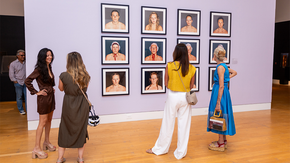 Lowe Art Museum patrons view works on display during the opening reception for “She’s a Knockout,” which features works by 11 contemporary artists from around the world.