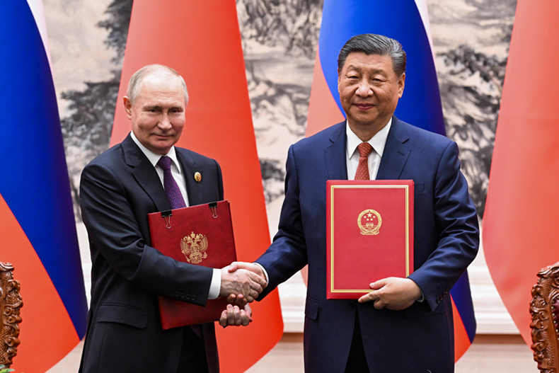 In this photo released by Xinhua News Agency, Chinese President Xi Jinping, right, and Russian President Vladimir Putin attend a signing ceremony at the Great Hall of the People in Beijing, Thursday, May 16, 2024. (Rao Aimin/Xinhua via AP)
