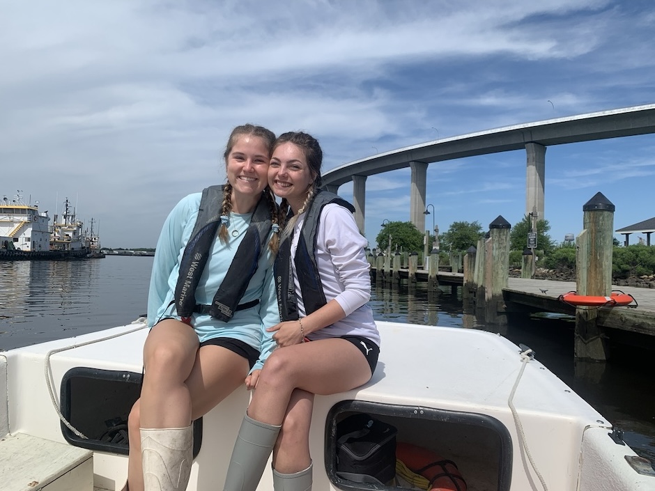 Jessica Jarratt and a peer on a research boat in Virginia.