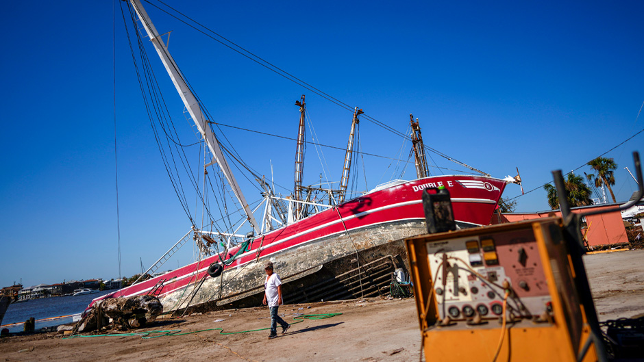 A shrimp boat lies grounded on San Carlos Island in Fort Myers Beach, Florida, on Oct. 7, 2022, after Hurricane Ian battered Southwest Florida.