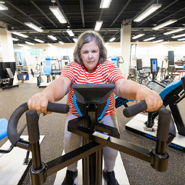 Gladys Mendez,  73, from Miami, works out doing  weight training exercises at the Max Orvitz Laboratory as part of a study on aging gracefully.