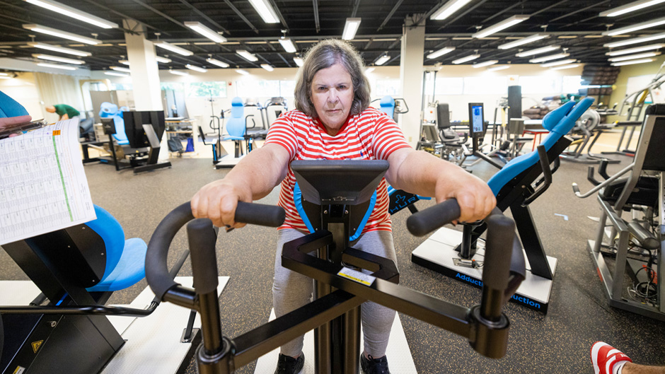 Gladys Mendez performs weight training exercises at the Laboratory of Neuromuscular Research and Active Aging in the Max Orovitz Building on the Coral Gables Campus. 