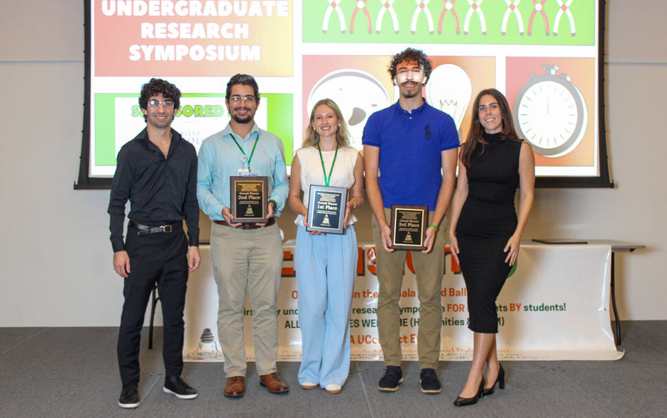 Students are recognized on stage during the inaugural EnvisionU research symposium.