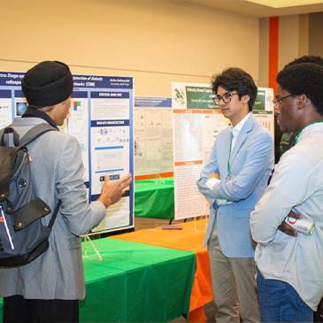 Students engage in discussion about research during the inaugural EnivionU symposium at the Shalala Student Center.