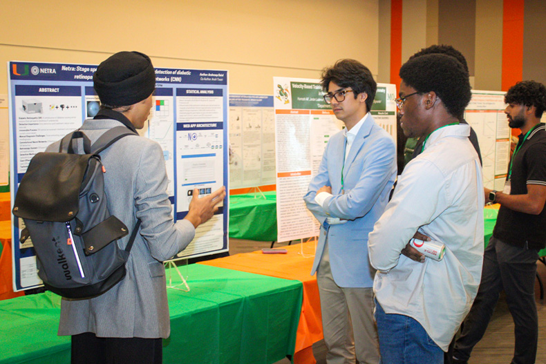 Students engage in discussion about research during the inaugural EnivionU symposium at the Shalala Student Center.