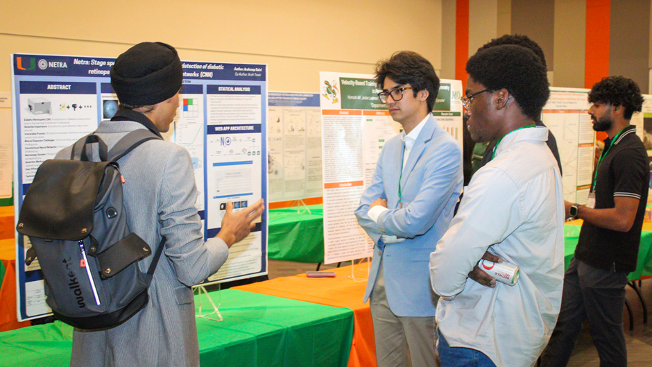 Students engage in discussion about research during the inaugural EnivionU symposium at the Shalala Student Center.