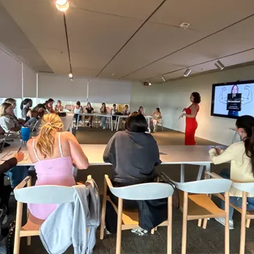 University alumna Alexa Ferra, senior director of marketing and communications at PAMM, speaks to undergraduate students 