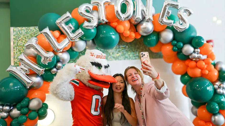 Participants take selfies during an event at Mahoney-Pearson Dining Hall.