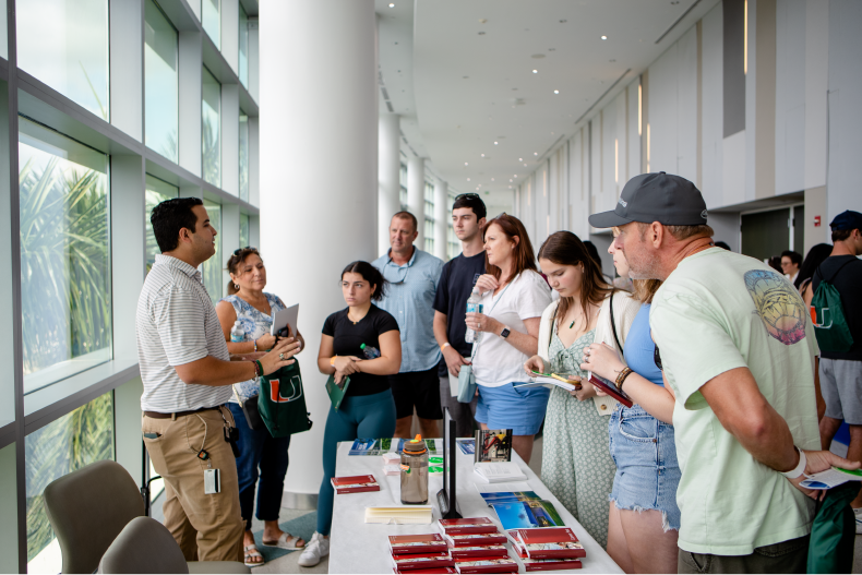 Families speaking to University of Miami representative at Preview the U. 