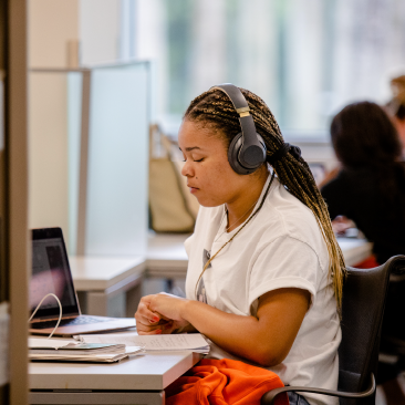 Student studying in the Richter Library. 