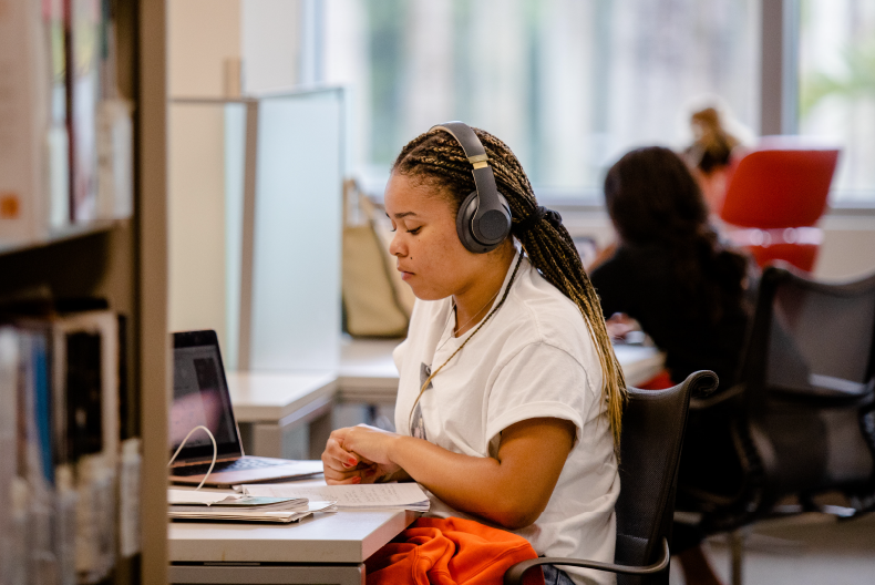 Student studying in the Richter Library. 