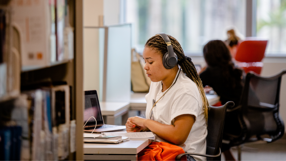 Student studying in the Richter Library.