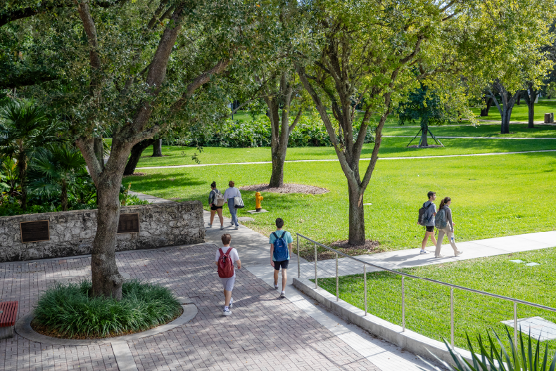 Students walking through the Dooley Memorial courtyard.