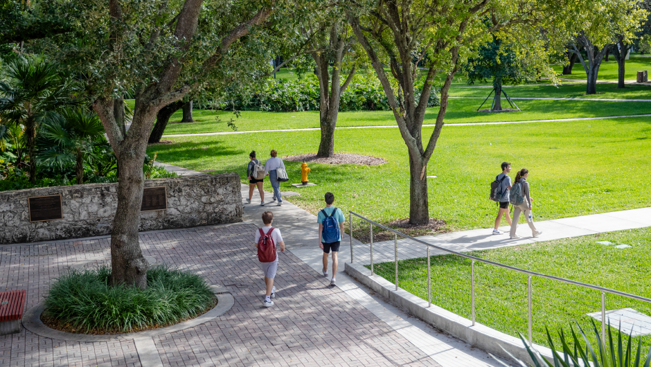 Students walking through the Dooley Memorial courtyard.