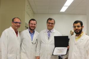 Chemists receiving an award for having a good lab