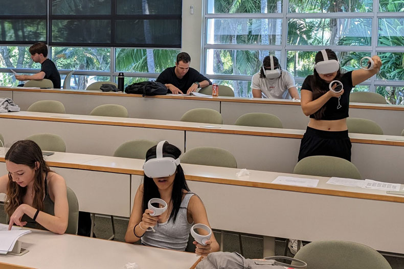 Students using virtual reality headsets in a philosophy class