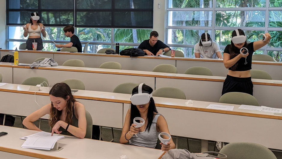 Students using virtual reality headsets in a philosophy class