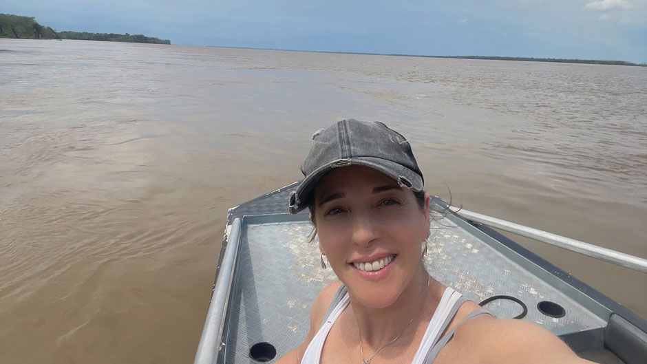 racy Devine Guzmán traveling on a boat in Amazonas, Brazil.