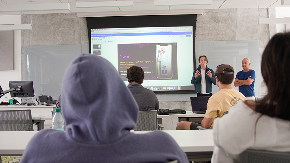 Calum Worthy and Russell Geyser speaking to the design thinking class