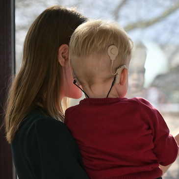 Child with cochlear implant and mother 